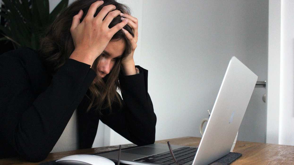 Frustrated woman looking at computer