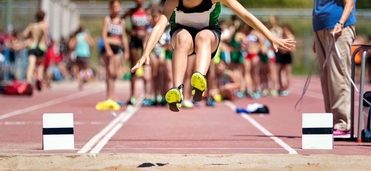 Girls long jumps at track meet