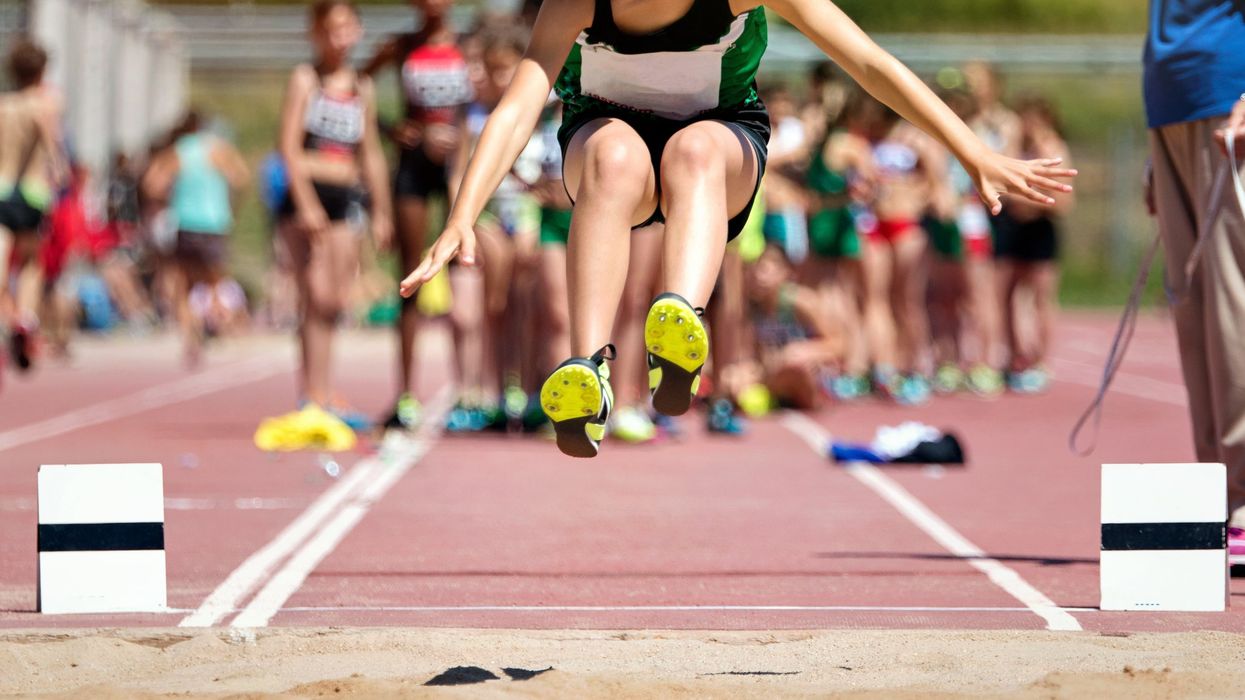 Girls long jumps at track meet