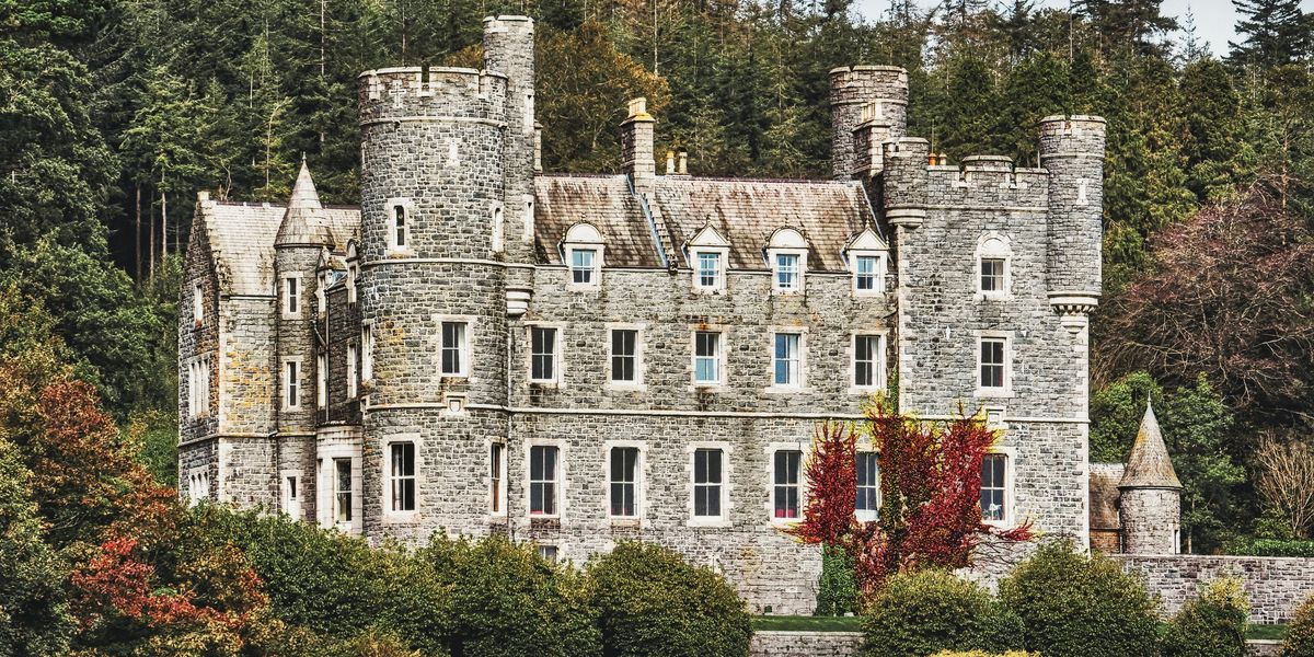 grey concrete building near trees during daytime