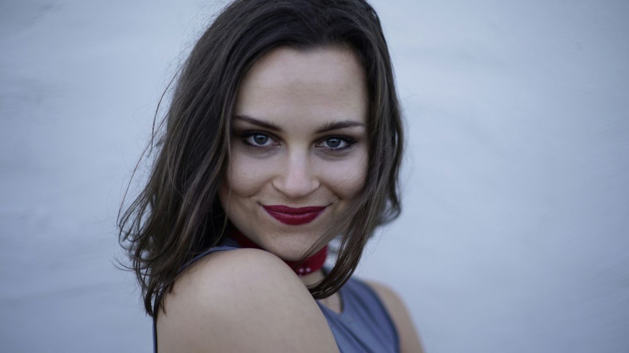 grinning woman with red lipstick