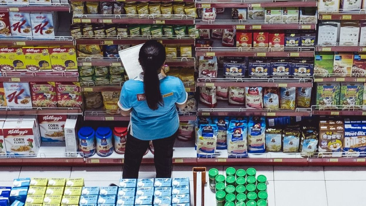 Grocery store worker checking inventory