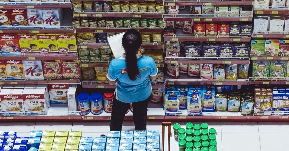 Grocery store worker checking inventory
