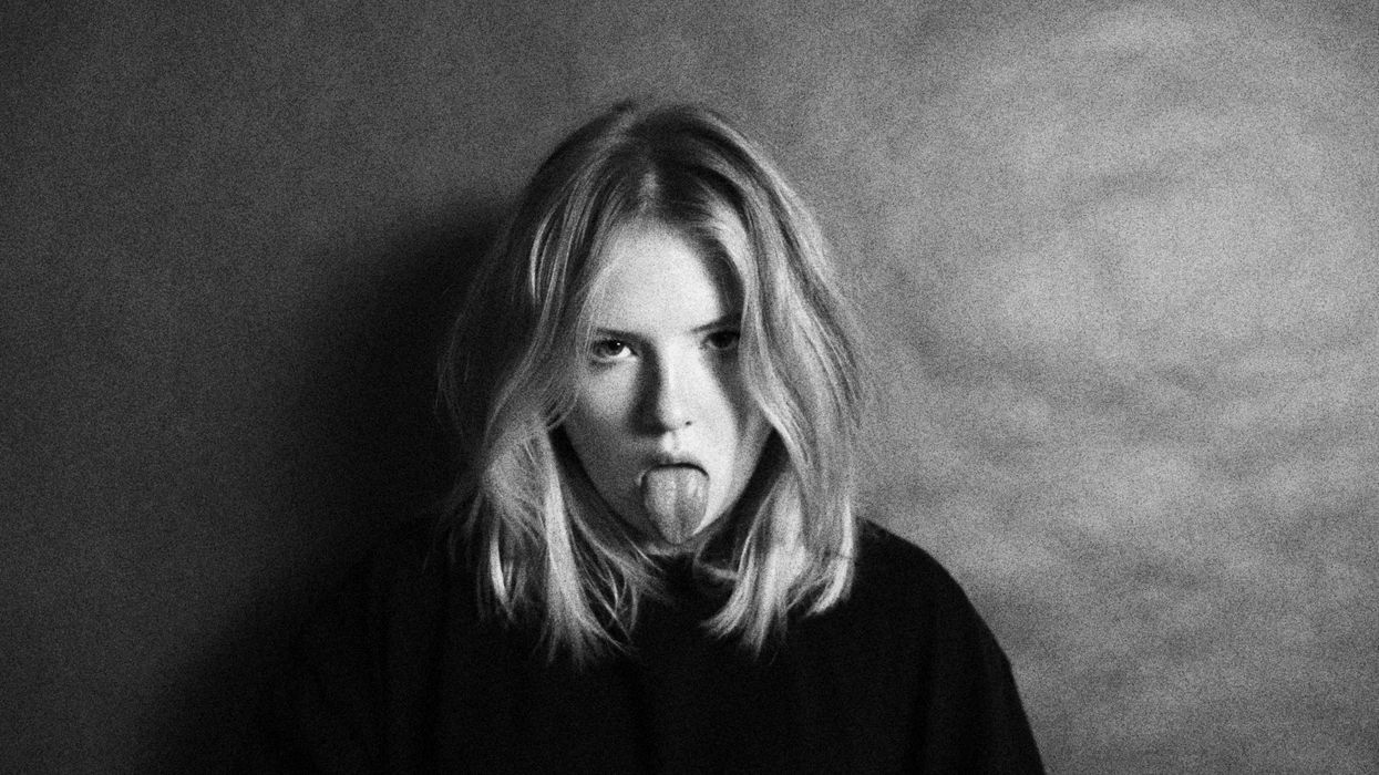 Grossed out woman sticking her tongue out