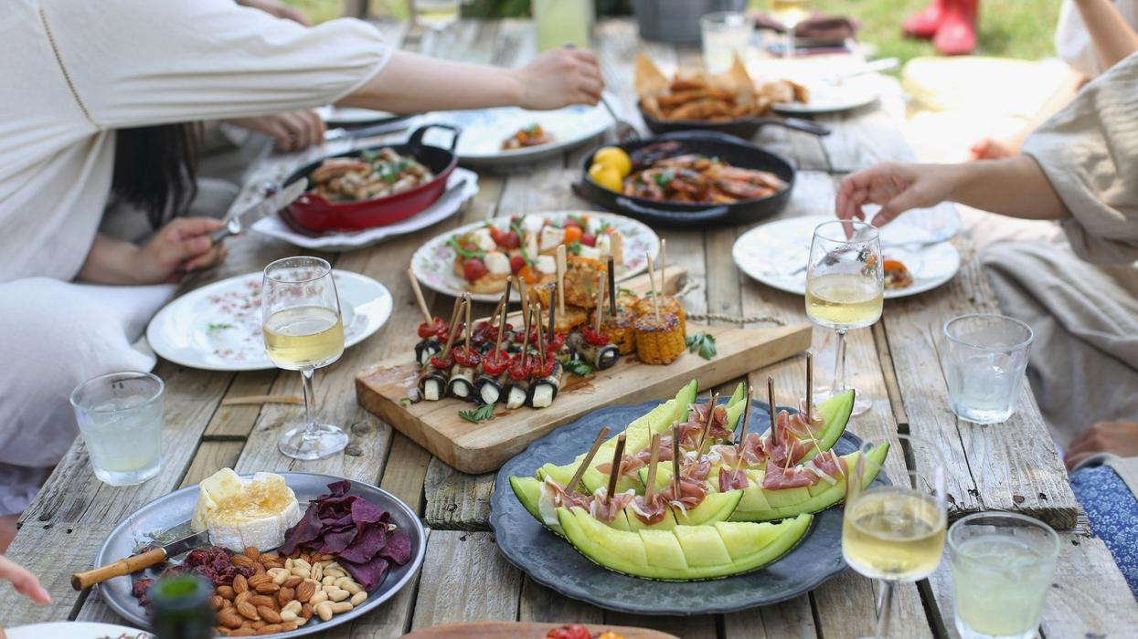 group of people eating on picnic table