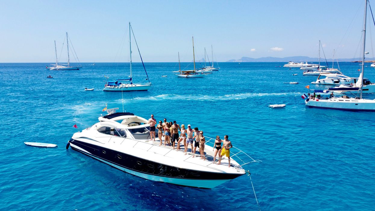 group of people on a boat in the ocean