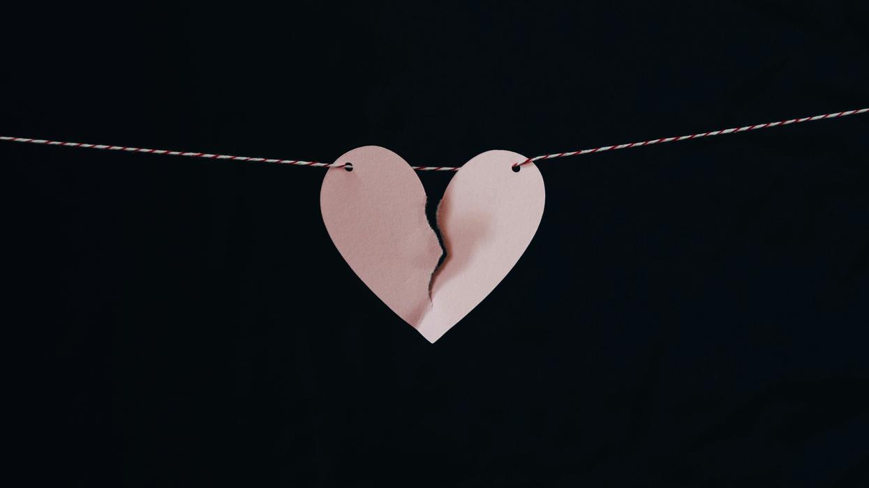 Hanging paper heart ripped apart