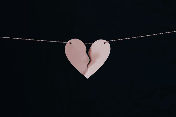 Hanging paper heart ripped apart