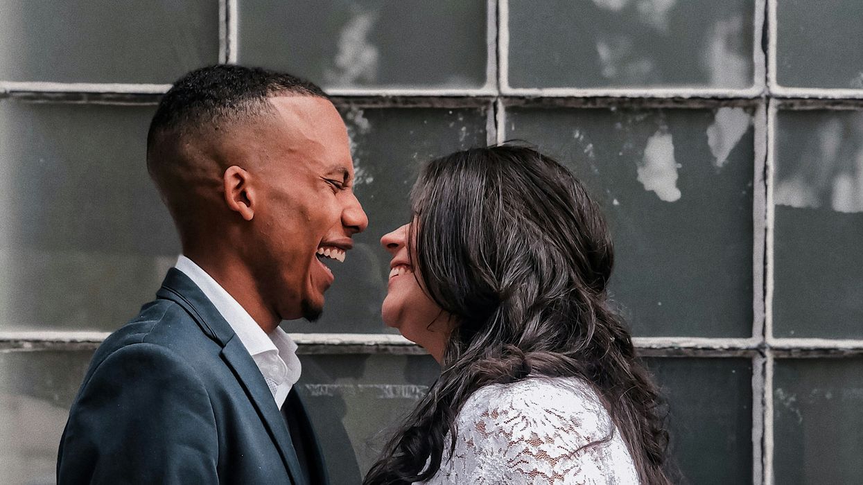 Happy couple laughing on their wedding day