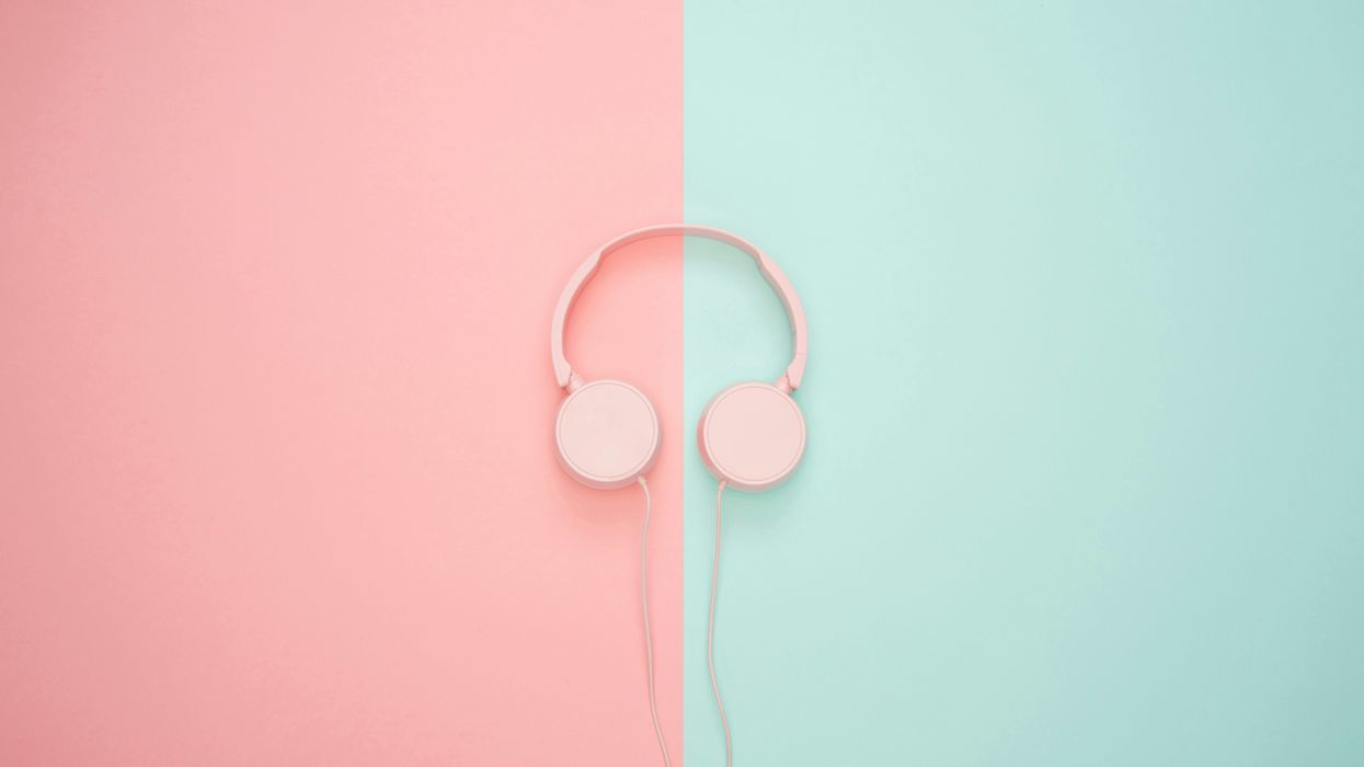 Headphones on a dual pink and green background