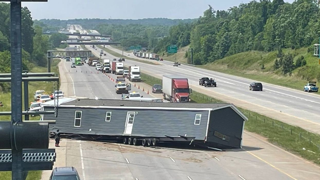House blocking highway traffic
