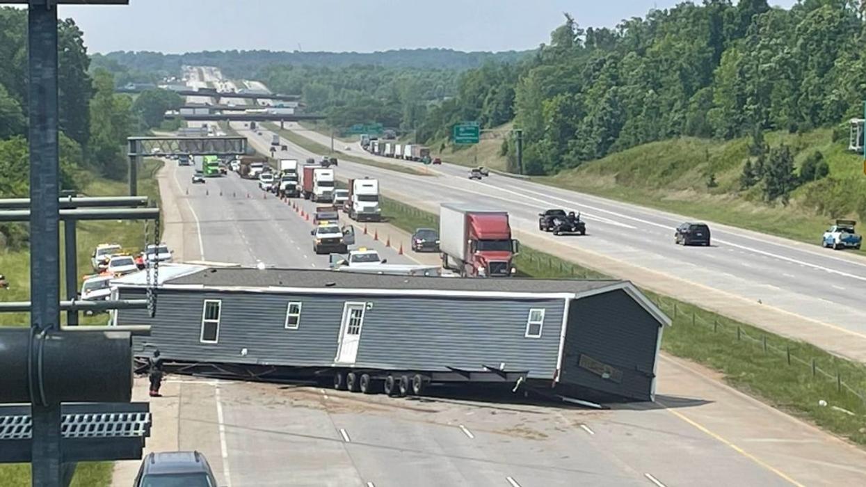 House blocking highway traffic
