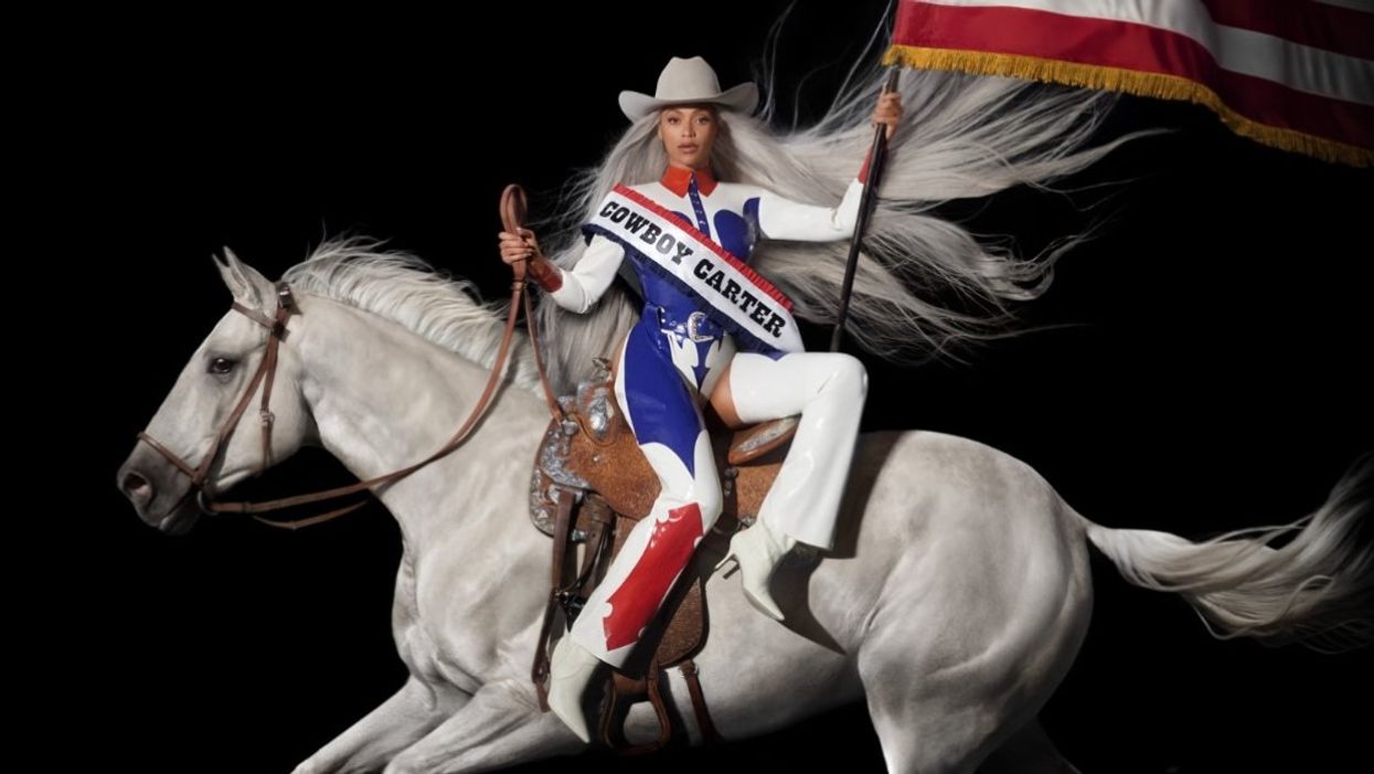 Image of Beyonce with a "Cowboy Carter" sash riding a horse