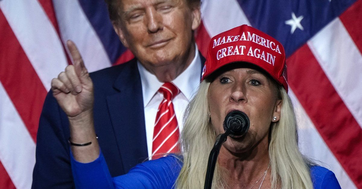 Image of Marjorie Taylor Greene in a 'Make America Great Again' hat with Donald Trump