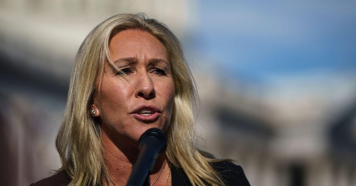 QAnon Rep. Slammed For Posting Anti-Trans Sign Outside Door Of Colleague With Trans Daughter