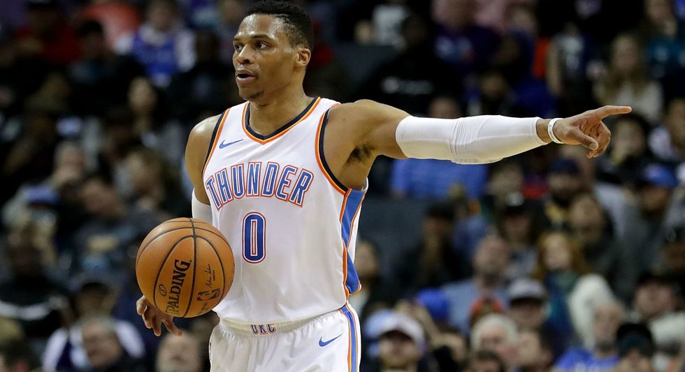 A Basketball Fan Just Stormed the Court & Got in a Losing Player's Face