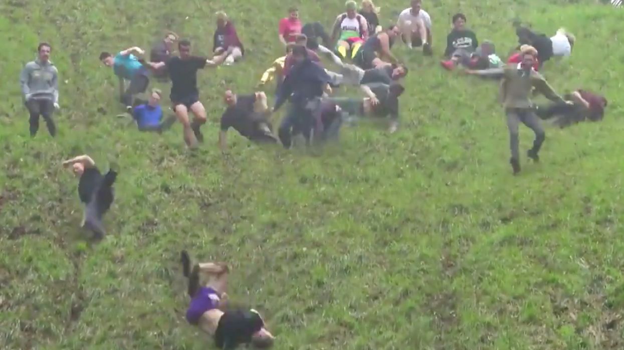 A Mass Of British People Just Chased A Wheel Of Cheese Down A Hill—And It Looks Painful 😖