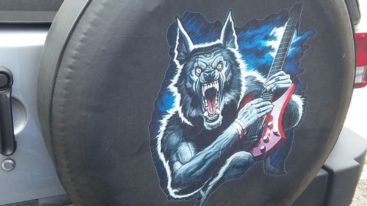 This Bizarre Decal Of A Wolf Playing A Guitar Gets Even Better Upon Closer Inspection 😂