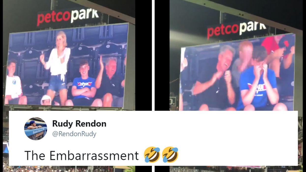Teen Can't Hide His Embarrassment Over Dancing Adults Next To Him On The Jumbotron đ