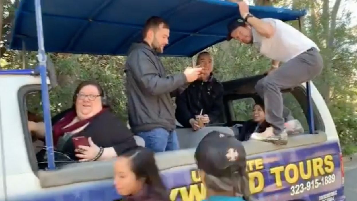 Mark Wahlberg Surprised Some Unsuspecting Fans By Literally Jumping On Their Hollywood Tour Bus