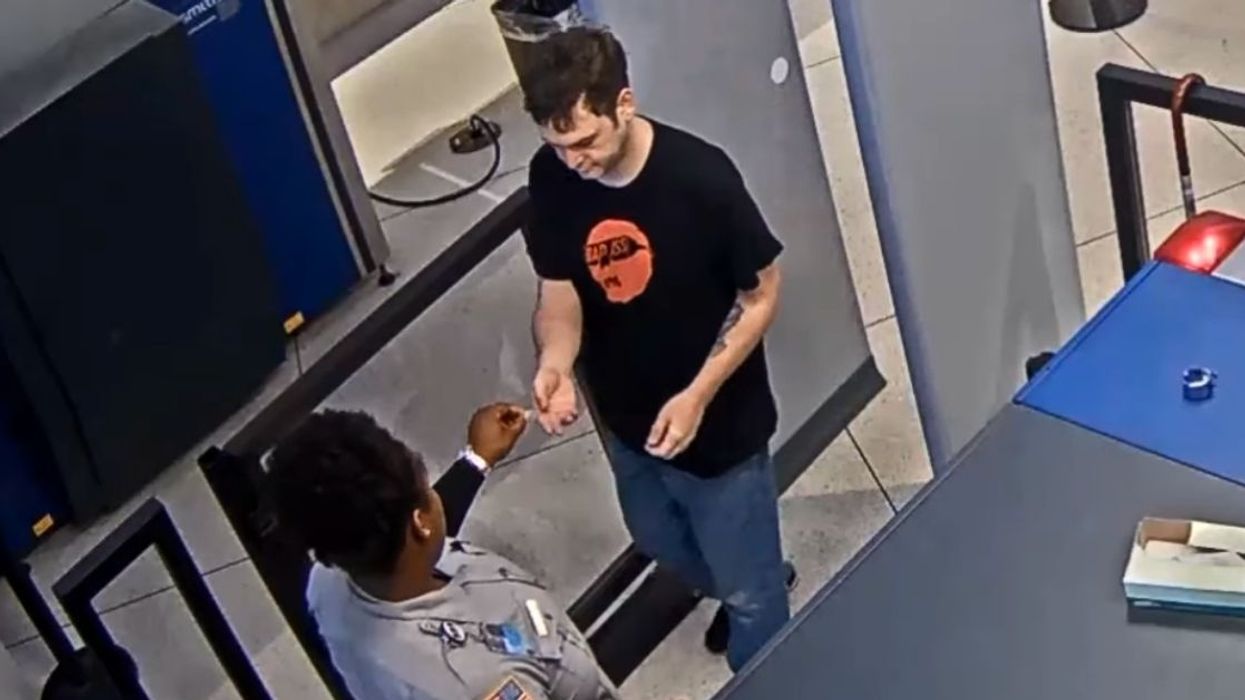 Airport Worker Fired After Video Shows Her Slipping A Passenger A Note Calling Him 'Ugly'