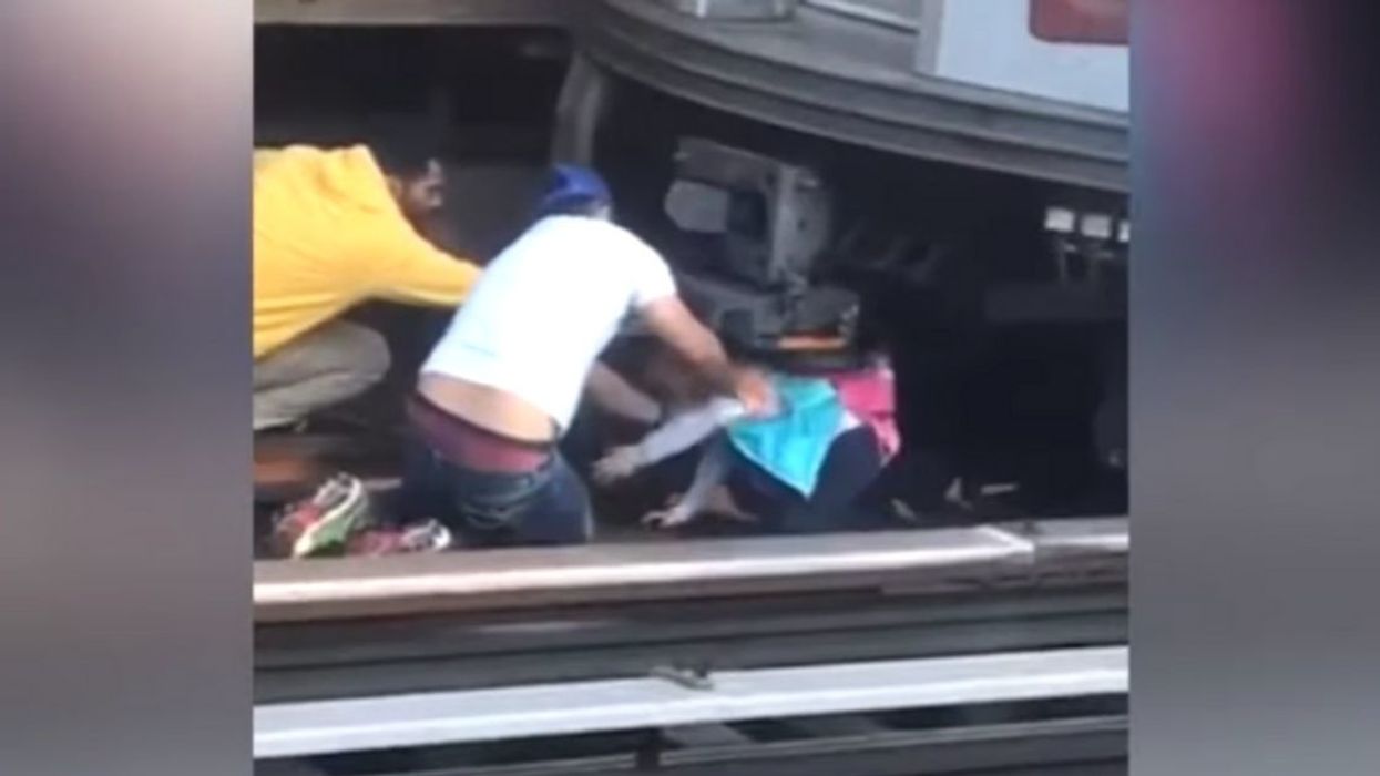 Dramatic Video Shows Commuters Rescuing 5-Year-Old Girl From Under Subway Train After Dad's Suicide