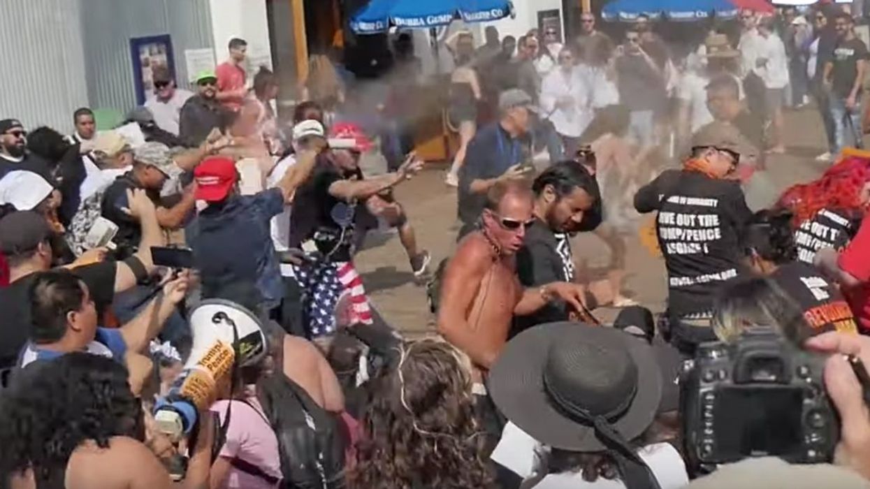 Trump Supporter In MAGA Hat Creates Panic On Pier After Unleashing Bear Spray On Anti-Trump Protesters