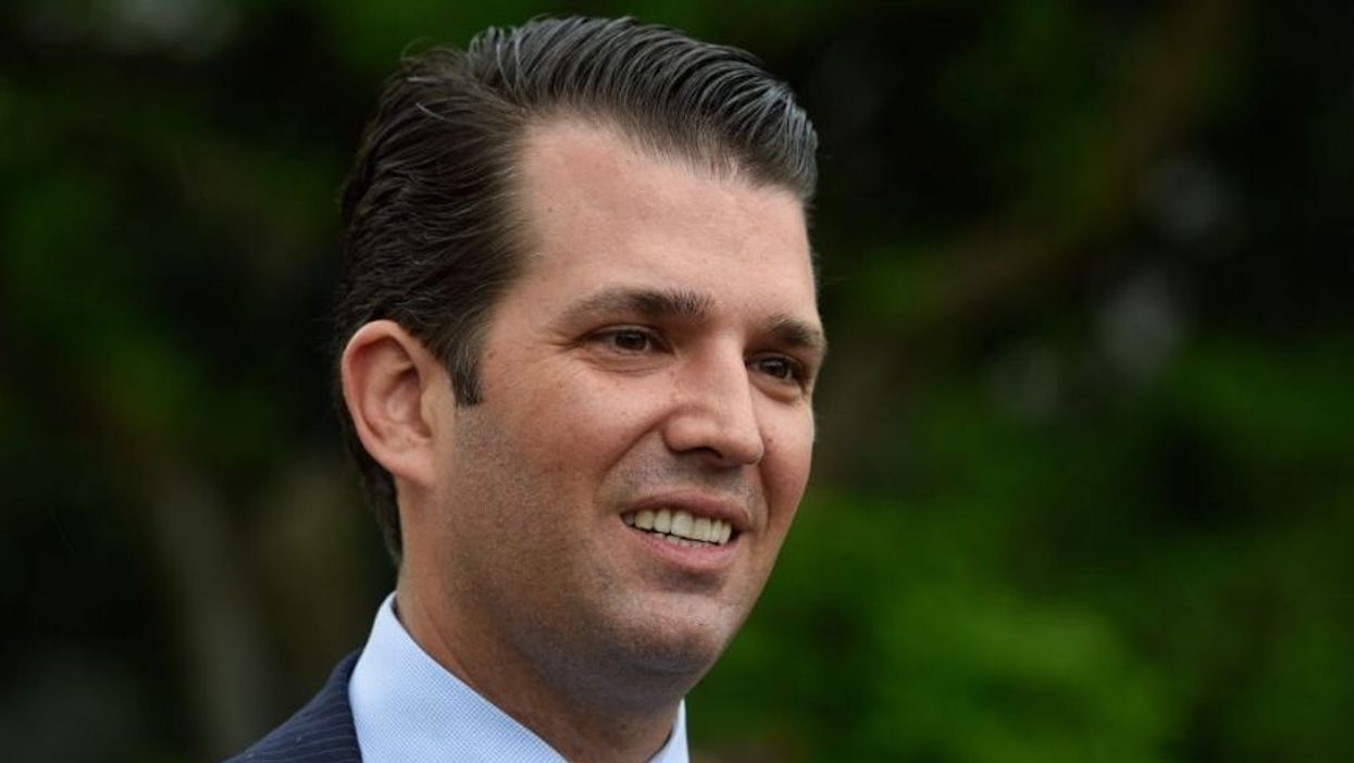 Don Jr. Is Getting Dragged for Showing Off an AR-15 Decked Out With a Likeness of Hillary Clinton Behind Bars