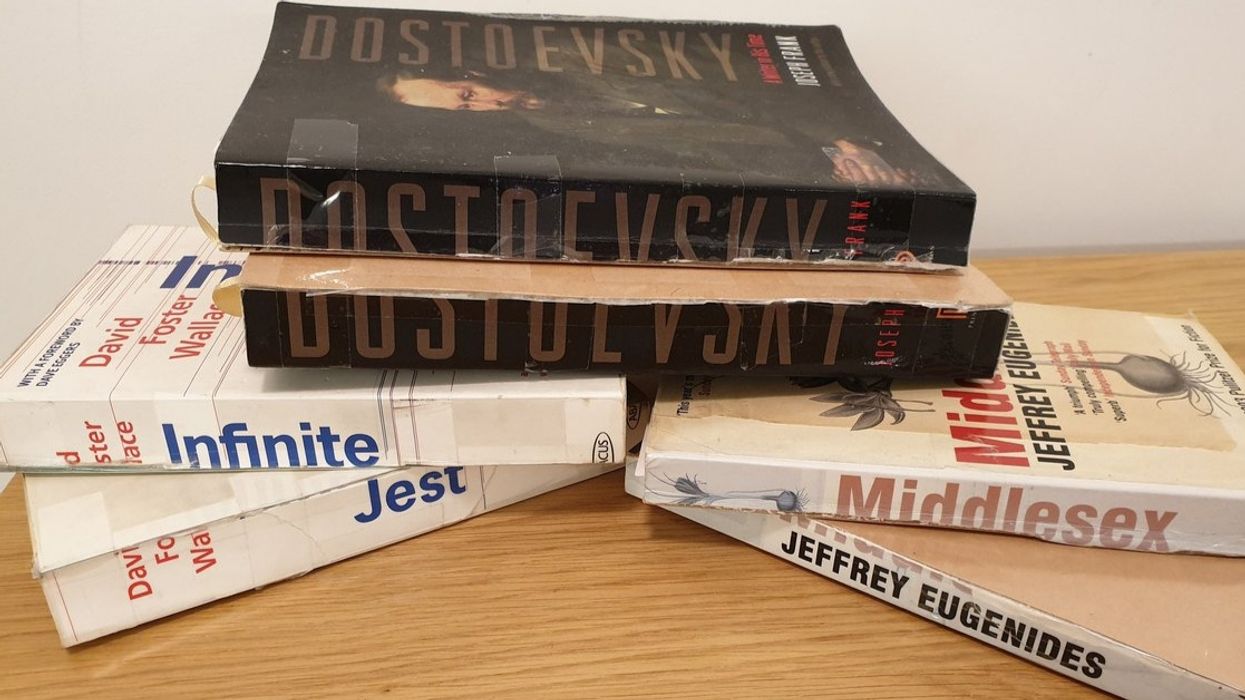 Guy Horrifies Book Purists After Admitting That He Cuts Lengthy Books In Half For Easier Transport