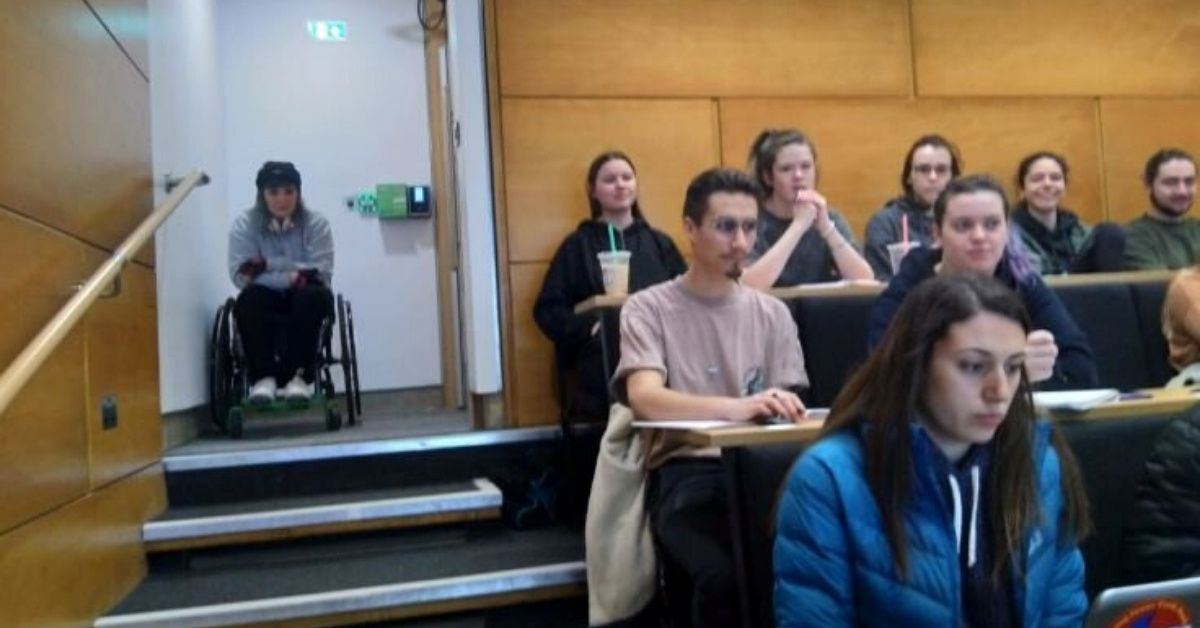 Wheelchair-Using Student Calls Out University For Discrimination After Being Forced To Sit In Stairwell Of Lecture Halls