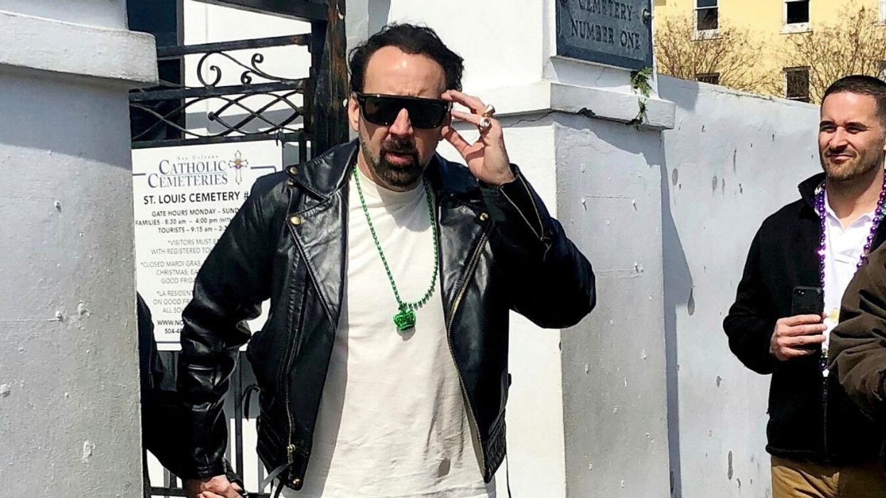 Nicolas Cage And A Mystery Woman Dressed In Matching Leather Outfits Just Casually Swung By The Cemetery To Check Out His Massive Tomb