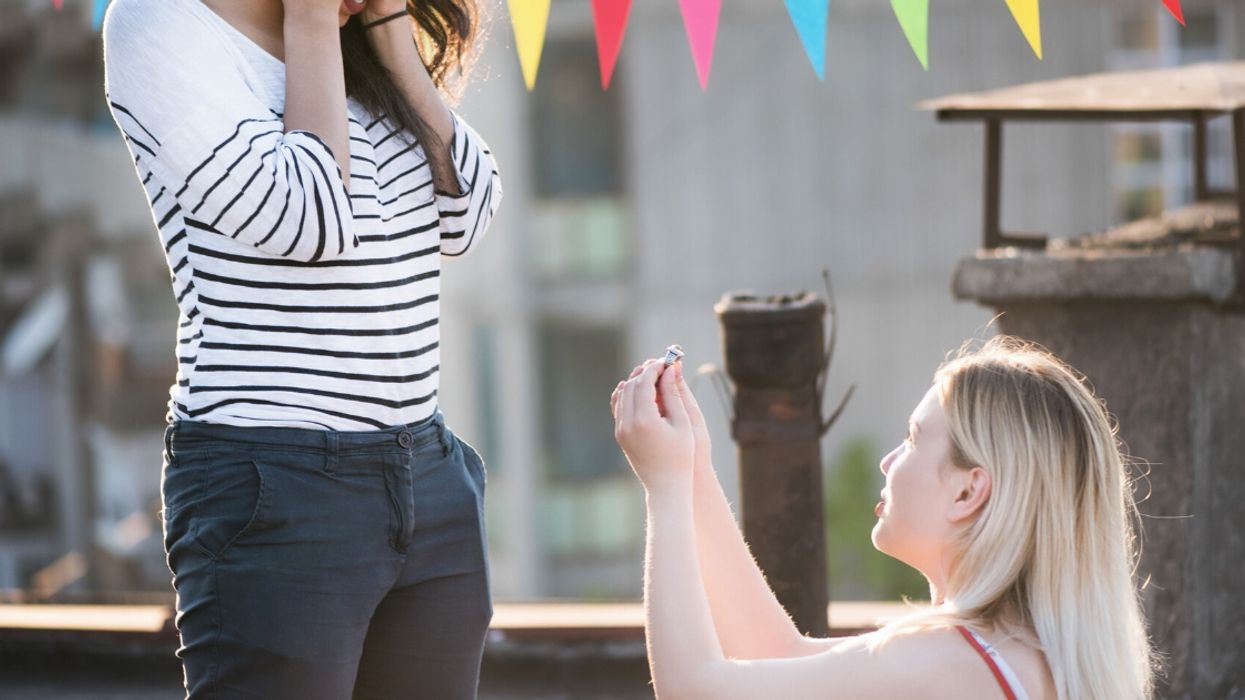 Woman Sparks Drama After Proposing To Her Girlfriend At Her Homophobic Twin Sister's Baby Shower