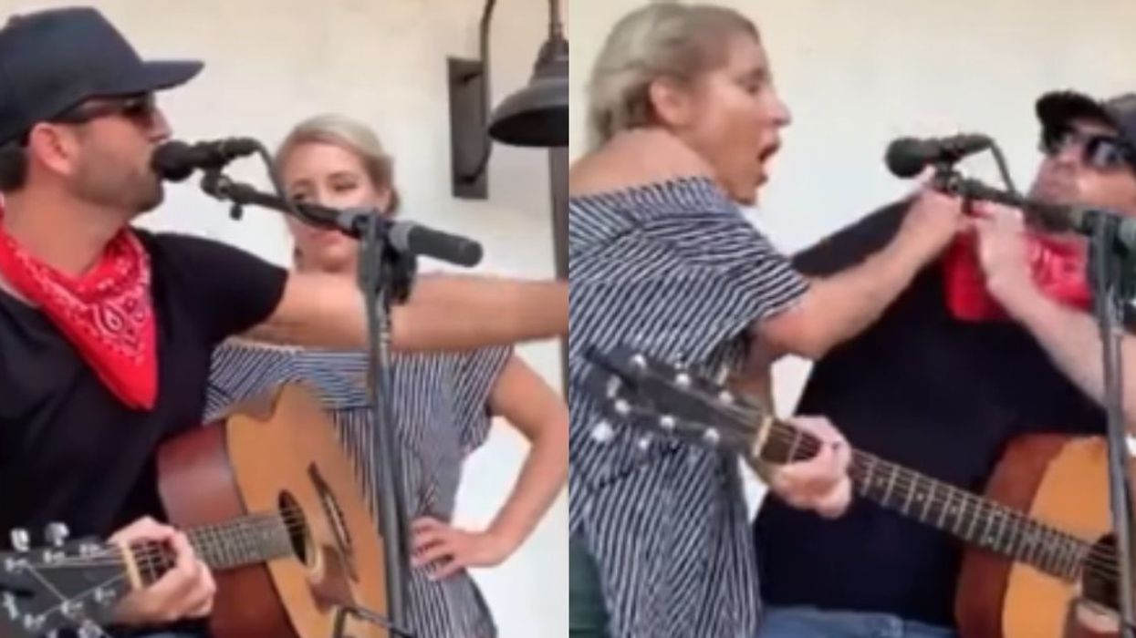 Woman Without Mask Gets Up In Musician's Face During Concert After He Denies Her Song Request