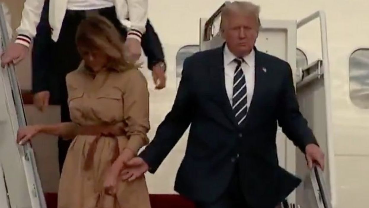 Cringeworthy Video of Trump Trying to Hold Melania's Hand Has People Joking That She'll Vote for Biden