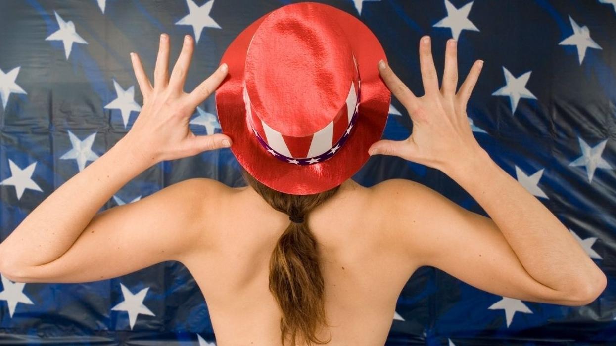 New Hampshire Voter Was Told She Couldn't Wear Her Anti-Trump Shirt, So She Whipped It Off And Voted Topless