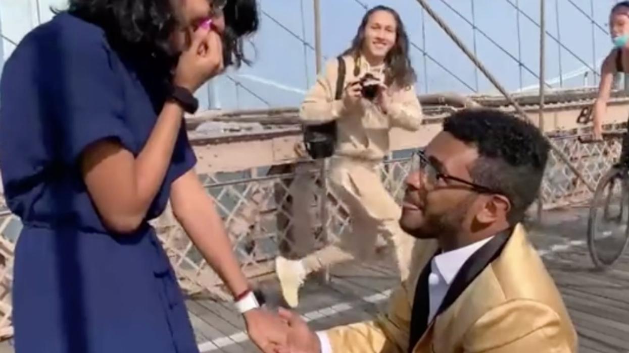 Guy's Proposal On The Brooklyn Bridge Goes Painfully Awry After Cyclist Slams Into Photographer