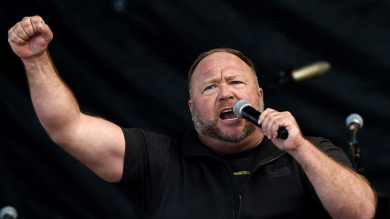 Alex Jones Tells Cheering Crowd Biden 'Will Be Removed, One Way Or Another' In Alarming Video