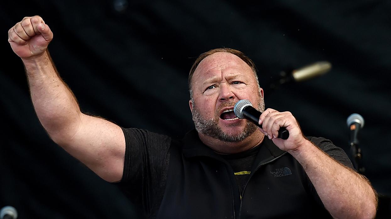 Alex Jones Tells Cheering Crowd Biden 'Will Be Removed, One Way Or Another' In Alarming Video