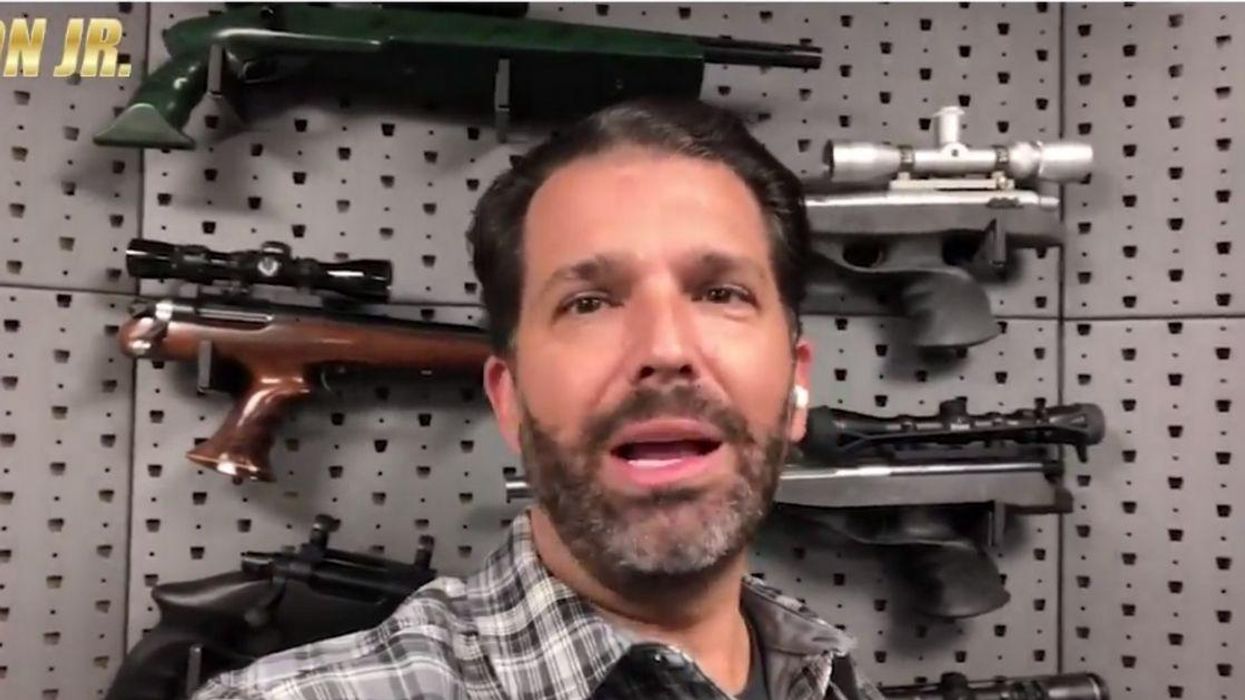 Don Jr. Slammed For Railing Against Teachers Union While Standing In Front Of Wall Of Guns