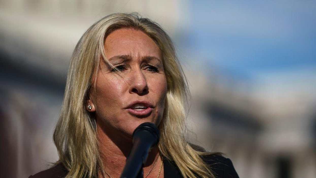 QAnon Rep. Slammed For Posting Anti-Trans Sign Outside Door Of Colleague With Trans Daughter