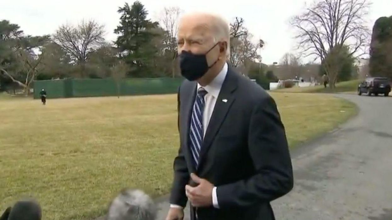 Conspiracy Theorists Lose Their Minds After Biden's Hand 'Floats Through' Reporter's Boom Mic