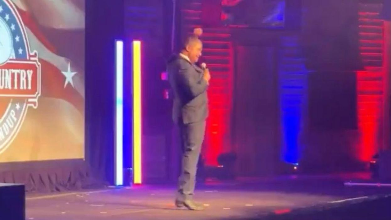 Ex-Adviser To Roger Stone Makes 'Hang Hillary' Gesture As Far-Right Crowd Cheers In Unsettling Video