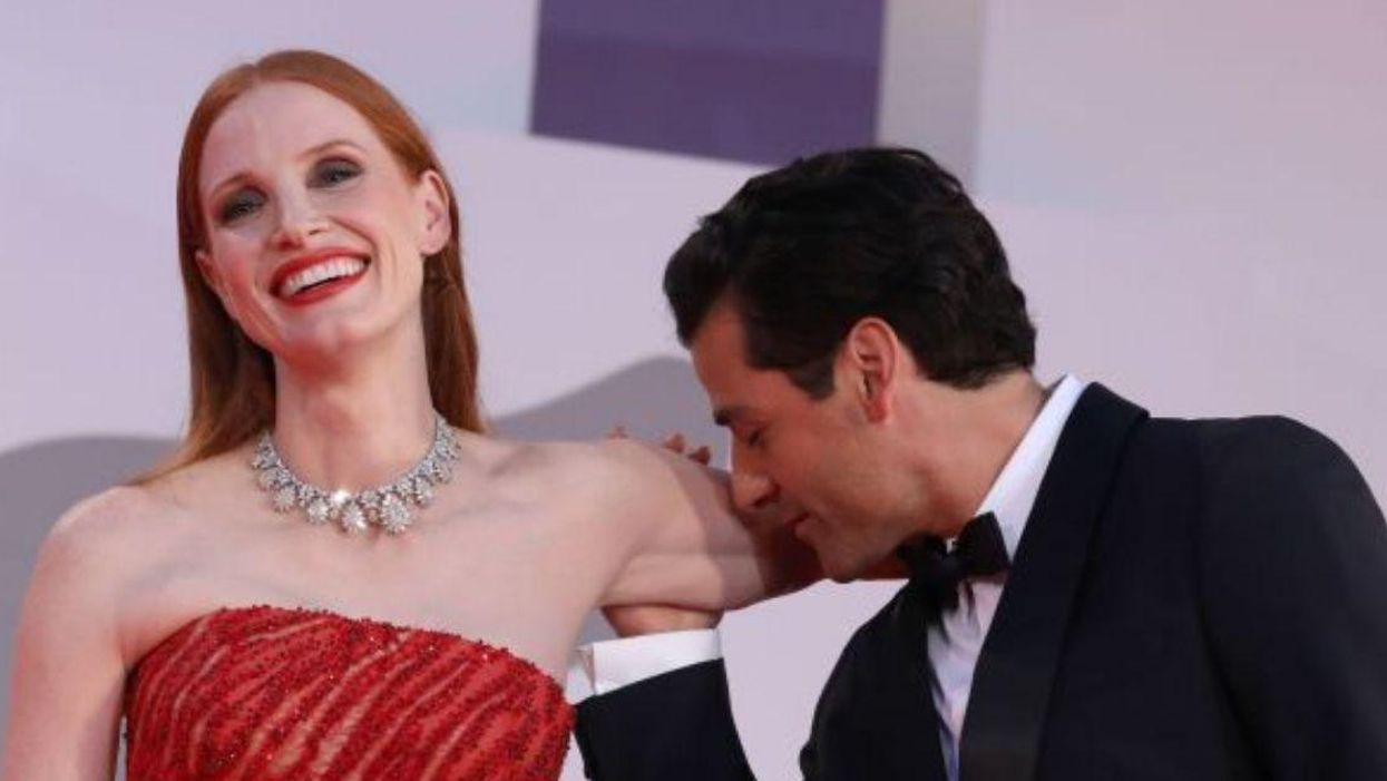Jessica Chastain Coyly Responds To Speculating Fans After Oscar Isaac Kisses Her Arm On Red Carpet