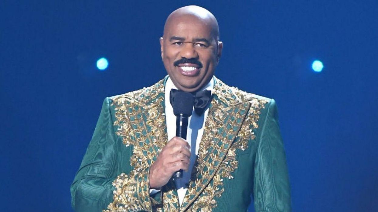 Steve Harvey Just Showed Off His Green Suit While Visiting Paris—And The Internet Photoshopped The Crap Out Of It