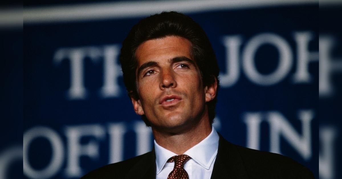 QAnoners Gather At Dallas' Grassy Knoll Believing JFK Jr. Will Show Up To Prove He's Still Alive