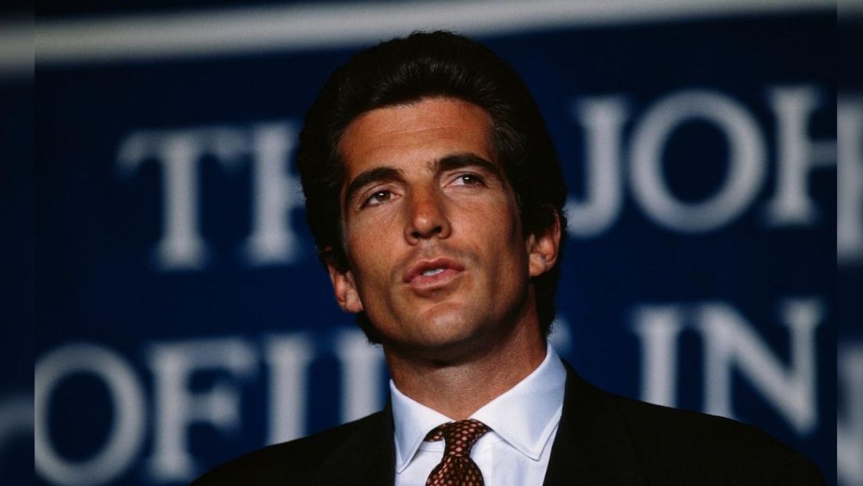 QAnoners Gather At Dallas' Grassy Knoll Believing JFK Jr. Will Show Up To Prove He's Still Alive
