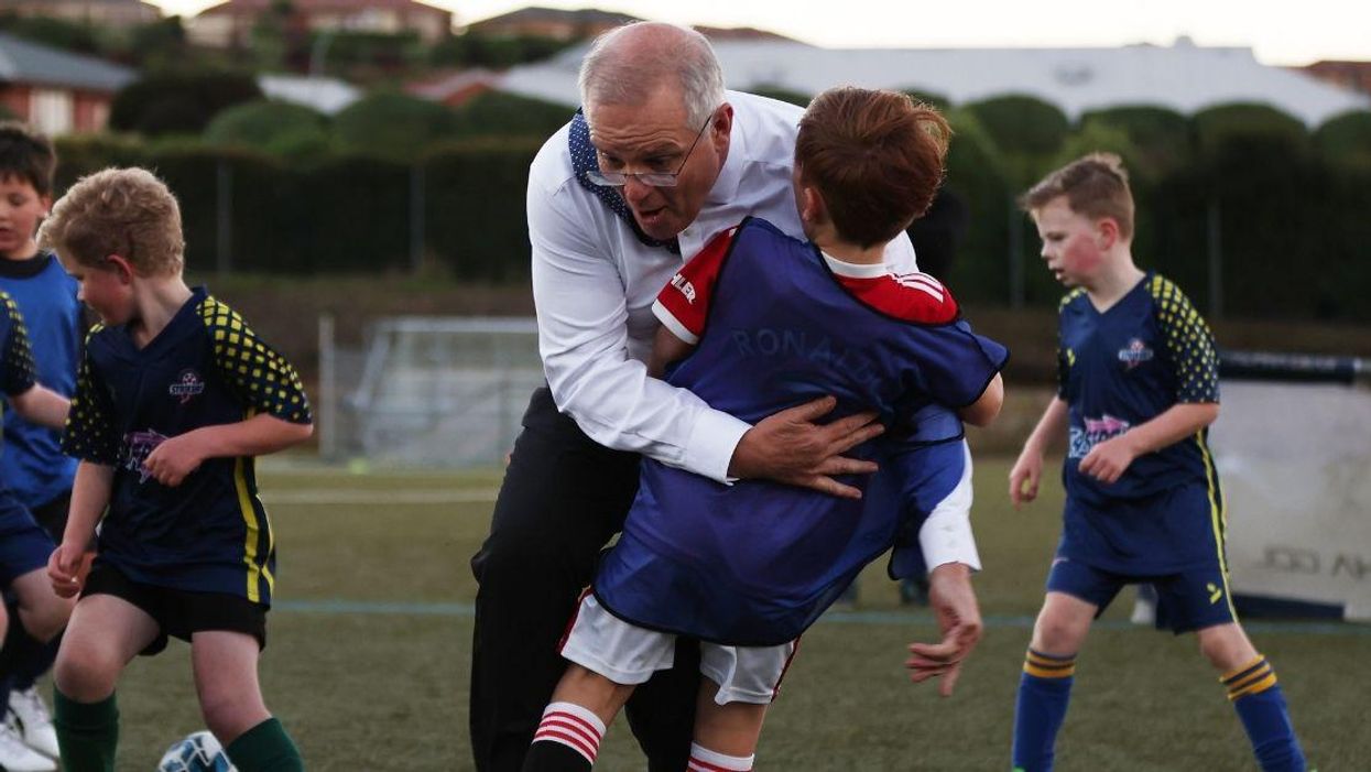 Australian Prime Minister Accidentally Tackles Young Boy While Playing Soccer—And Twitter Is LOLing