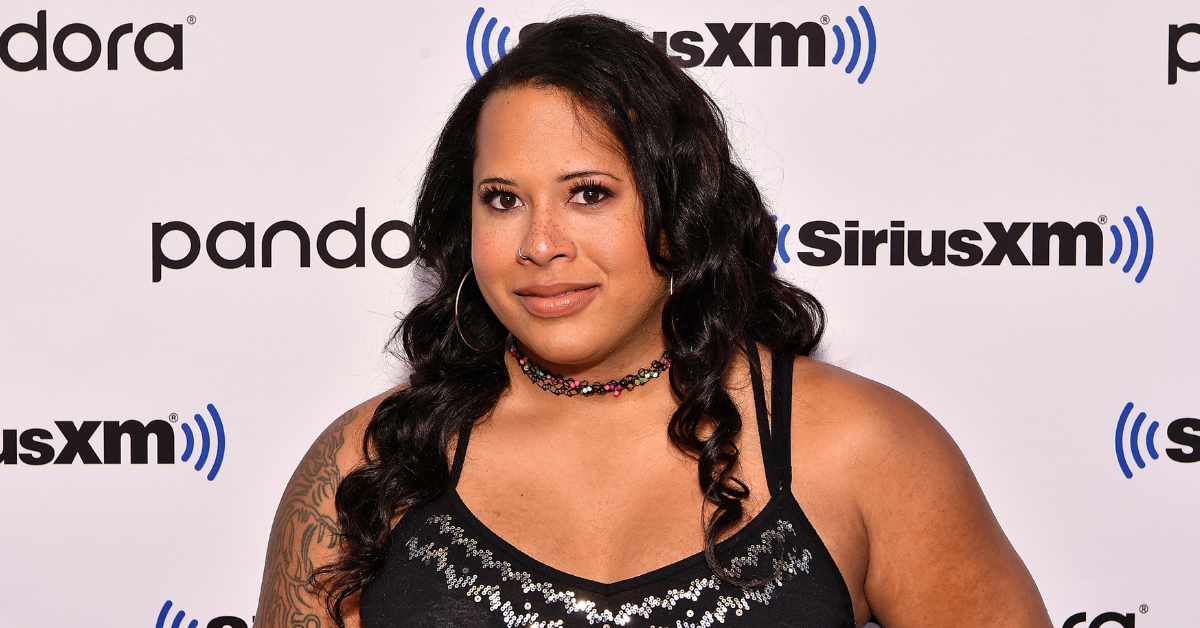 Trans Wrestler's Wife Rips Fan Who Held Up Transphobic Sign And Commentator Who Defended Him