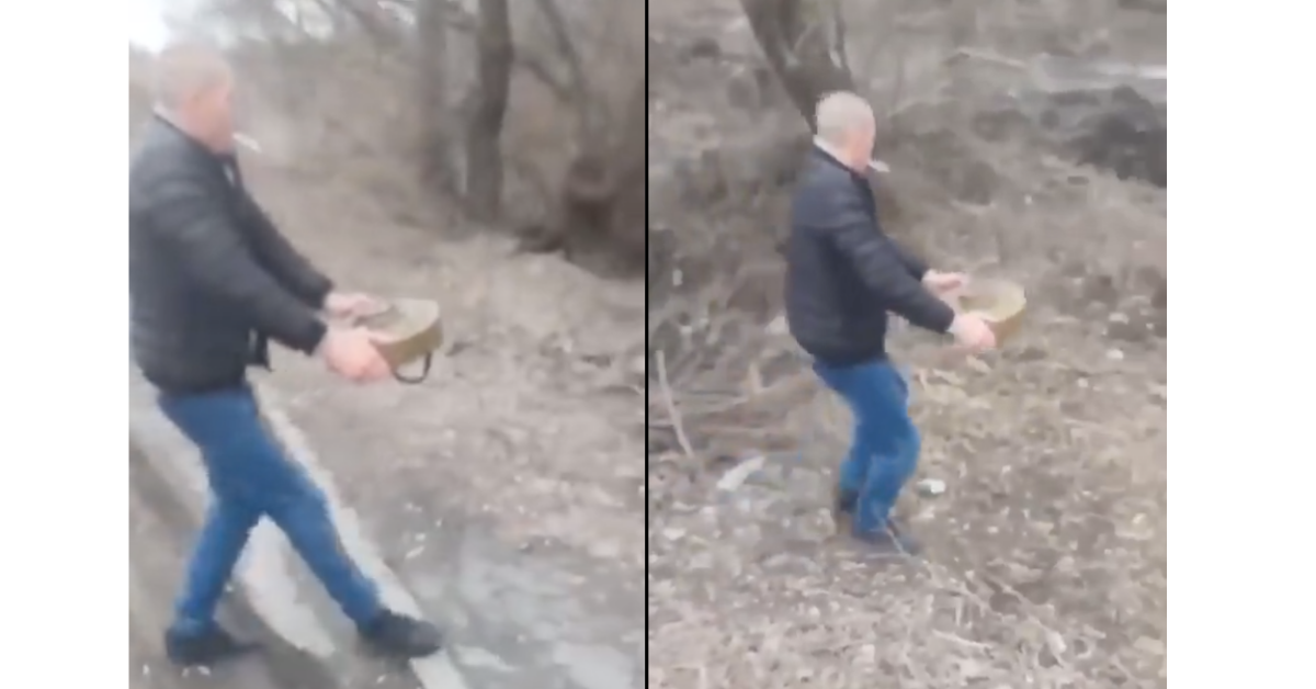 Fearless Ukrainian Man Removes Land Mine From Road With His Bare Hands In Surreal Video