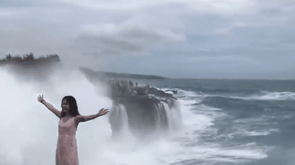 This Viral Video Of Giant Wave Crashing Into Unsuspecting Tourist Has Everyone Saying 'Ouch'